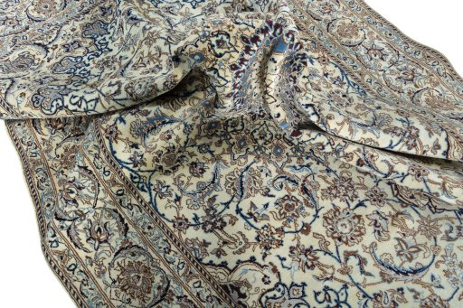 Surface texture of 2000s Nain rug with natural Wool and intricate pattern