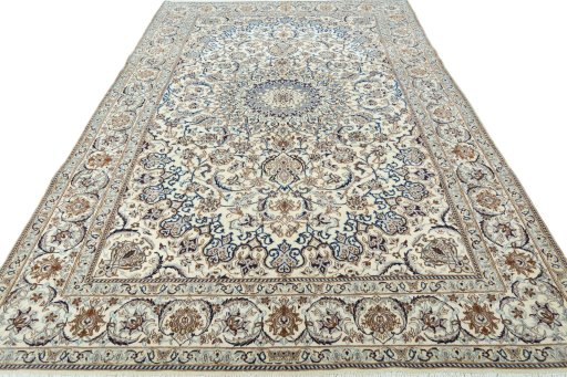 Surface texture of 2000s Nain rug with natural Wool and intricate pattern