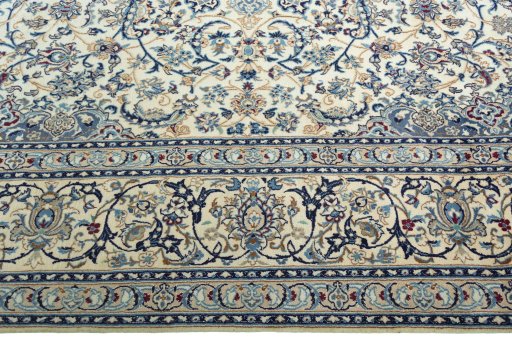 Corner detail of 2000s Nain rug showing border pattern and Wool pile