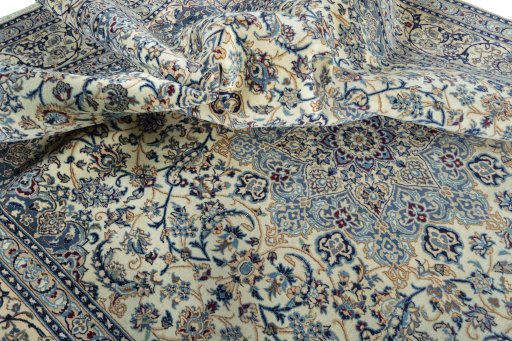 Surface texture of 2000s Nain rug with natural Wool and intricate pattern