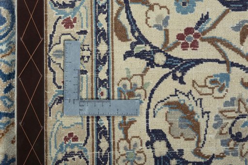 Backside of handmade 2000s Nain rug showing knot structure and weave density