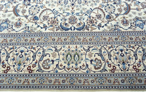 Corner detail of 2000s Nain rug showing border pattern and Wool pile