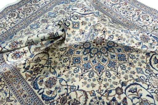 Surface texture of 2000s Nain rug with natural Wool and intricate pattern