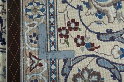 Backside of handmade 2000s Nain rug showing knot structure and weave density