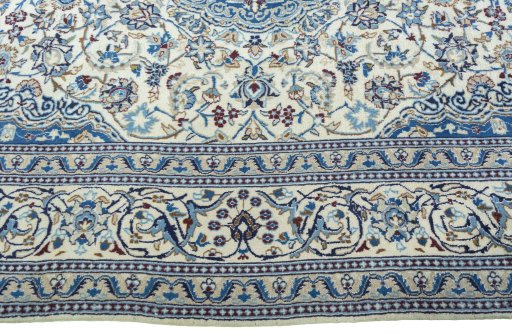 Corner detail of 2000s Nain rug showing border pattern and Wool pile