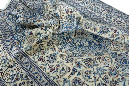 Surface texture of 2000s Nain rug with natural Wool and intricate pattern