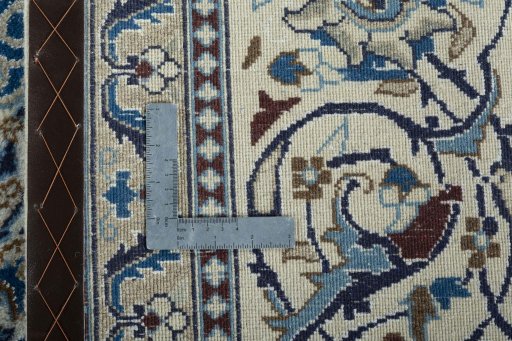 Backside of handmade 2000s Nain rug showing knot structure and weave density