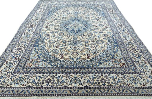 Surface texture of 2000s Nain rug with natural Wool and intricate pattern