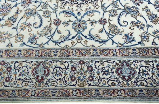 Corner detail of 2000s Nain rug showing border pattern and Wool pile