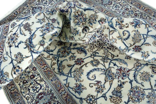 Surface texture of 2000s Nain rug with natural Wool and intricate pattern