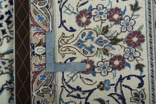 Backside of handmade 2000s Nain rug showing knot structure and weave density