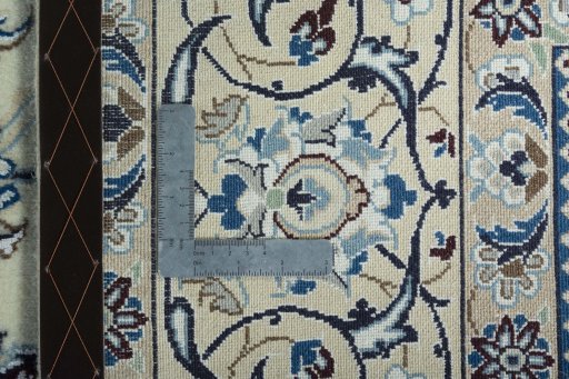 Backside of handmade 2000s Nain rug showing knot structure and weave density