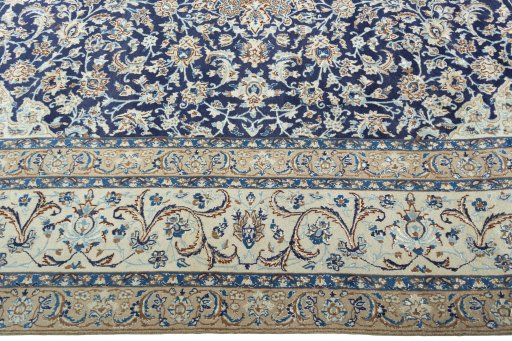 Corner detail of 2000s Nain rug showing border pattern and Wool pile