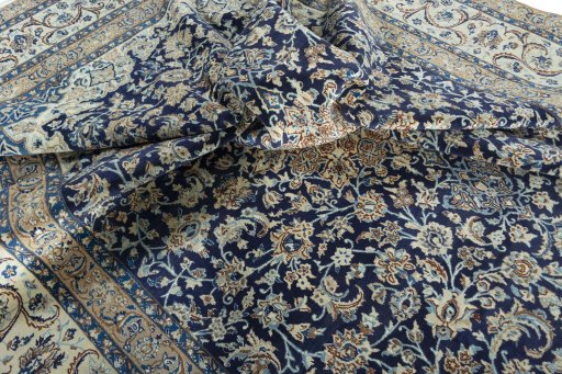 Surface texture of 2000s Nain rug with natural Wool and intricate pattern