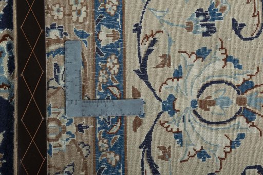 Backside of handmade 2000s Nain rug showing knot structure and weave density
