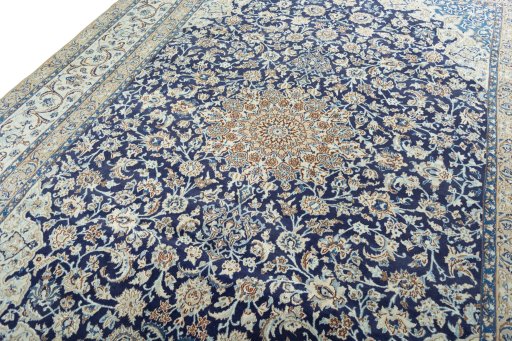 Backside of handmade 2000s Nain rug showing knot structure and weave density