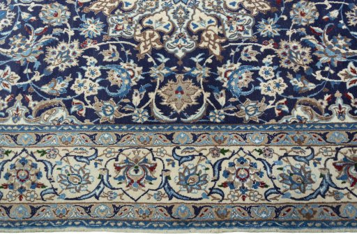 Corner detail of 2000s Nain rug showing border pattern and Wool pile