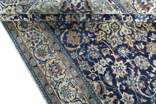 Close-up detail of 2000s Nain rug from Iran / Persia showing Wool weave