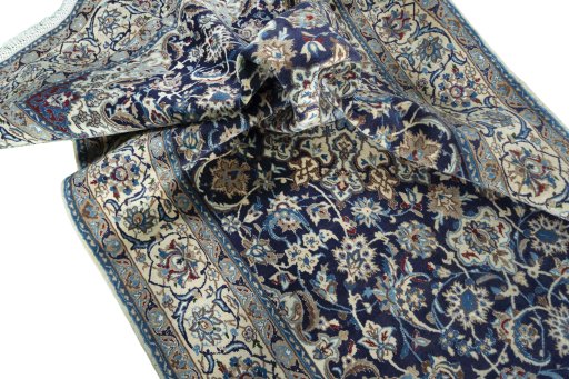 Surface texture of 2000s Nain rug with natural Wool and intricate pattern