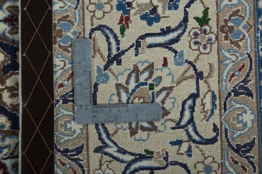 Backside of handmade 2000s Nain rug showing knot structure and weave density