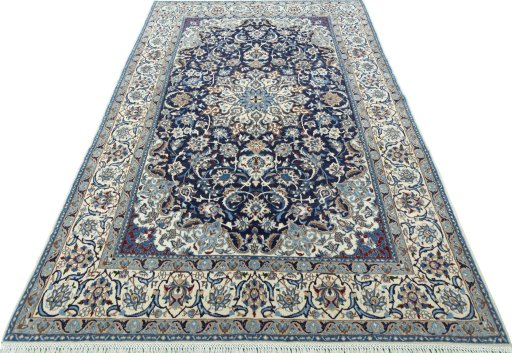 Surface texture of 2000s Nain rug with natural Wool and intricate pattern