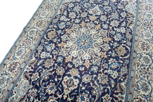 Backside of handmade 2000s Nain rug showing knot structure and weave density