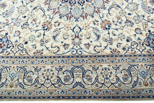 Corner detail of 2000s Nain rug showing border pattern and Wool pile