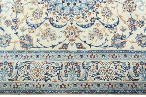 Corner detail of 2000s Nain rug showing border pattern and Wool pile