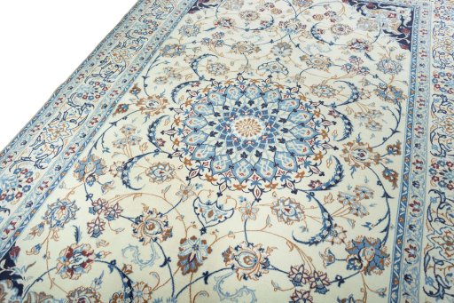 Backside of handmade 2000s Nain rug showing knot structure and weave density