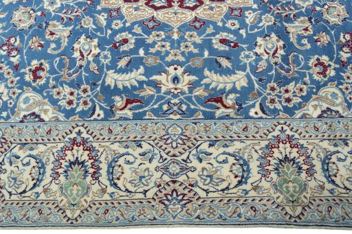Corner detail of 2000s Nain rug showing border pattern and Wool pile