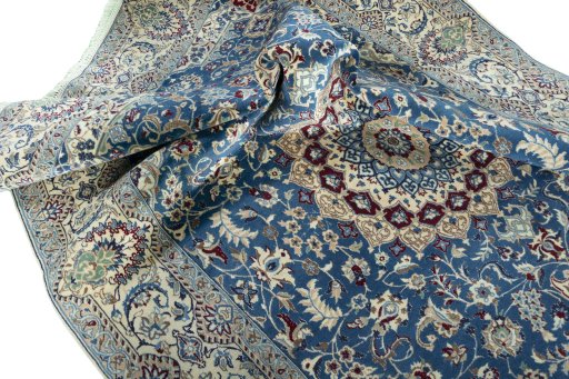 Surface texture of 2000s Nain rug with natural Wool and intricate pattern