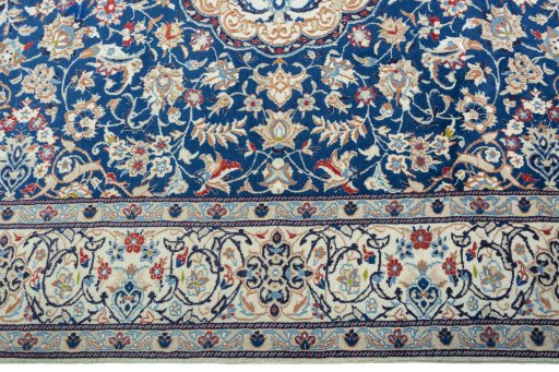 Corner detail of 2000s Nain rug showing border pattern and Wool pile