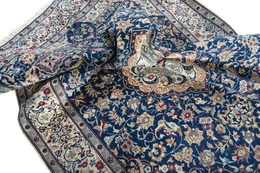 Surface texture of 2000s Nain rug with natural Wool and intricate pattern