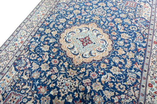Backside of handmade 2000s Nain rug showing knot structure and weave density