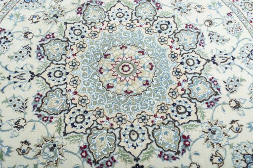 Backside of handmade New Nain rug showing knot structure and weave density