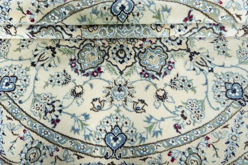 Close-up detail of New Nain rug from Iran / Persia showing Wool weave