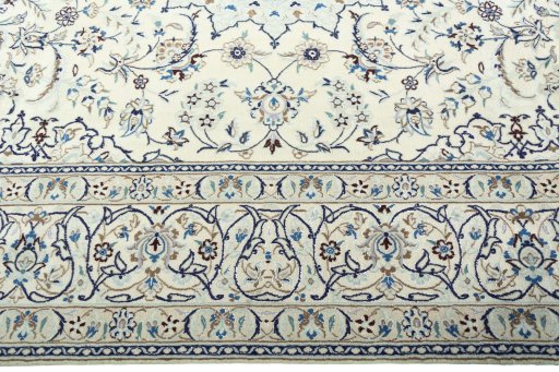 Corner detail of 2000s Nain rug showing border pattern and Wool pile
