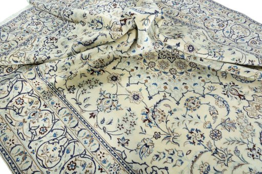 Surface texture of 2000s Nain rug with natural Wool and intricate pattern