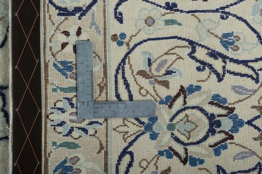 Backside of handmade 2000s Nain rug showing knot structure and weave density
