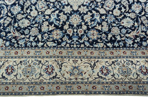 Corner detail of 2000s Nain rug showing border pattern and Wool pile