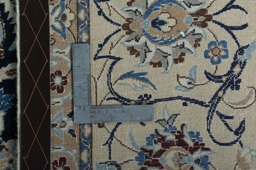 Backside of handmade 2000s Nain rug showing knot structure and weave density