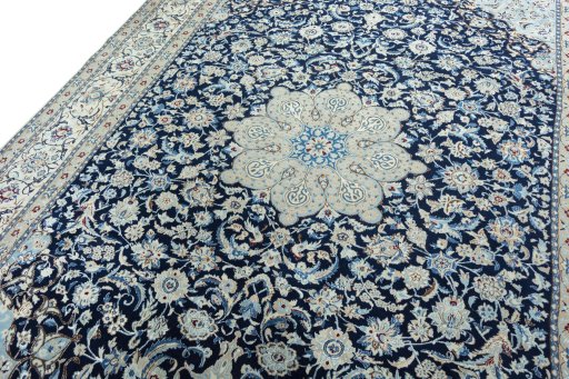 Backside of handmade 2000s Nain rug showing knot structure and weave density