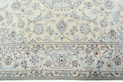 Corner detail of 2000s Nain rug showing border pattern and Wool pile