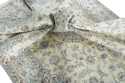 Surface texture of 2000s Nain rug with natural Wool and intricate pattern