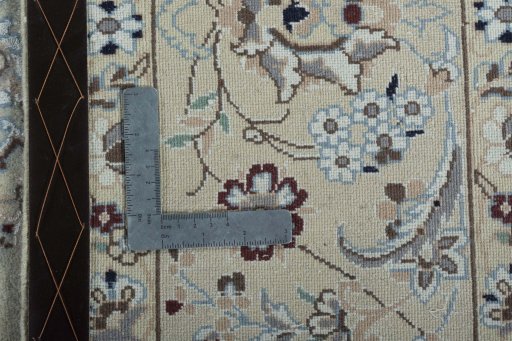 Backside of handmade 2000s Nain rug showing knot structure and weave density