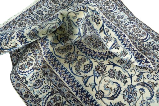 Surface texture of New Nain rug with natural Wool and intricate pattern
