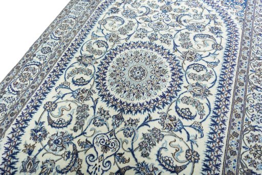 Backside of handmade New Nain rug showing knot structure and weave density