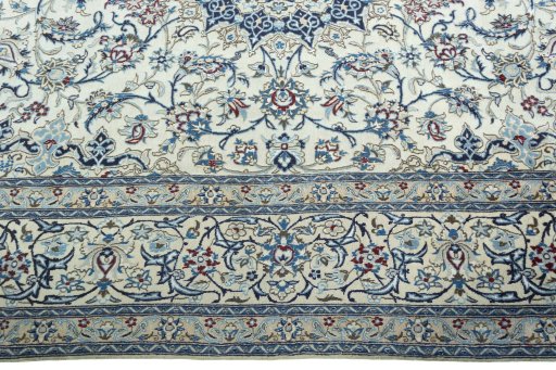 Corner detail of 2000s Nain rug showing border pattern and Wool pile