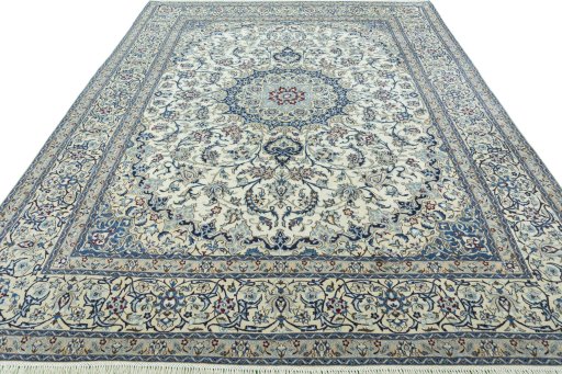 Surface texture of 2000s Nain rug with natural Wool and intricate pattern