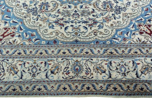Corner detail of 1970s Nain rug showing border pattern and Wool pile